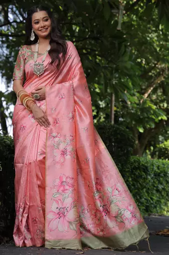 Peach tussar silk printed saree with floral pallu, traditional border, fancy tassels & contrast blouse