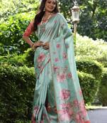 Mint green tussar silk printed saree with floral pallu, traditional border, fancy tassels & contrast blouse