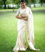 Off-white banarasi raw silk saree with zari lining weaving, premium zari border & running blouse