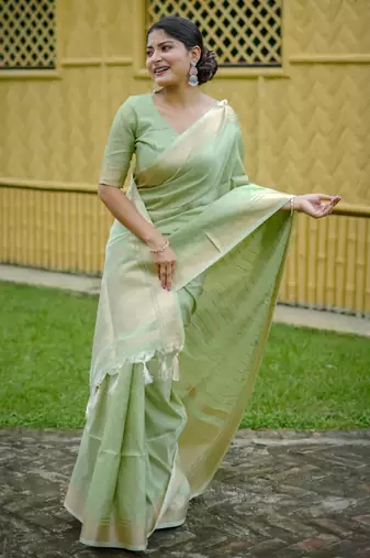Soft green banarasi raw silk saree with zari lining weaving, premium zari border, designer pallu & running blouse