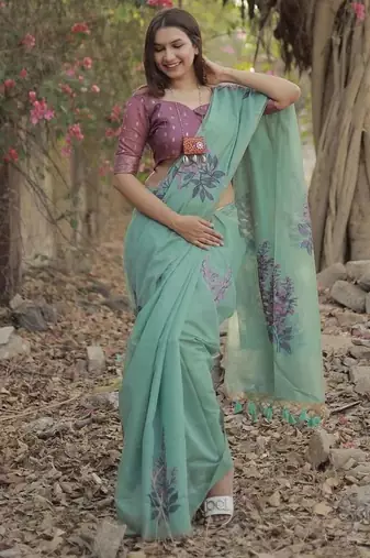 teal designer muga silk blend saree with all over floral weaving & classic tassels | trendy contrast blouse saree