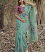 teal designer muga silk blend saree with all over floral weaving & classic tassels | trendy contrast blouse saree