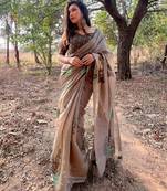 brown designer muga silk blend saree with all over floral weaving & classic tassels | trendy contrast blouse saree