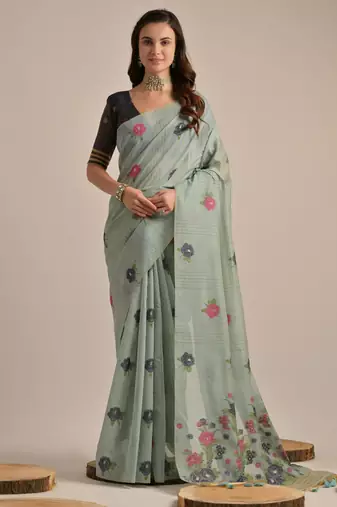 Teal muga cotton saree with motifs weaving pallu & floral buttas | lightweight daily wear saree with tassels & blouse