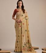 Light beige muga cotton saree with traditional pallu weaving & floral buttas | lightweight daily wear saree with tassels