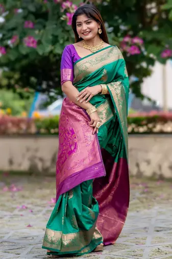 Dark green banarasi katan silk saree with all over zari weaving & rich contrast pallu