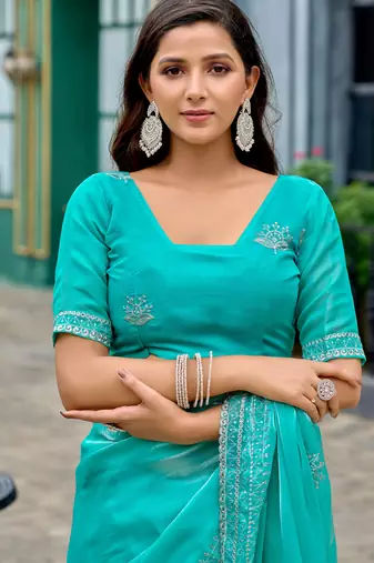 Turquoise embroidery work shimmer chiffon saree with unstitched blouse