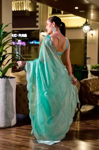 Turquoise embroidery work shimmer chiffon saree with unstitched blouse