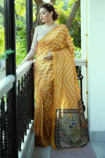 mustard tussar art silk leriya pattern saree with woven zari border & kalamkari work pallu     comes with blouse