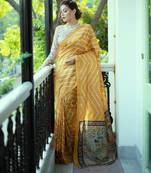 mustard tussar art silk leriya pattern saree with woven zari border & kalamkari work pallu     comes with blouse