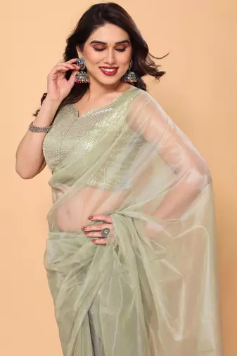 pista green net saree with sequin blouse