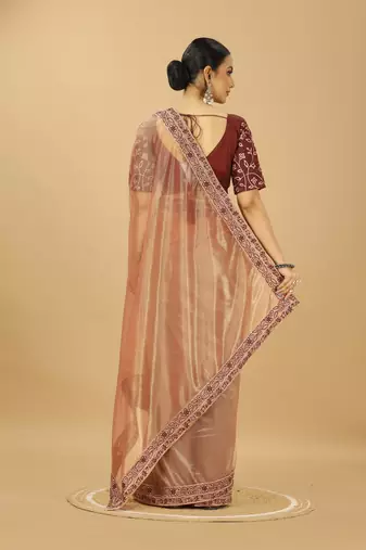 beige net saree with embroidered border & silk blouse