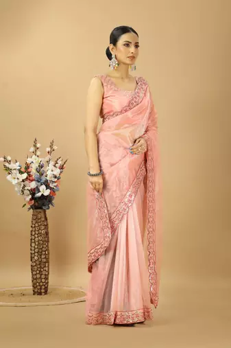 peach net embroidered saree with designer blouse