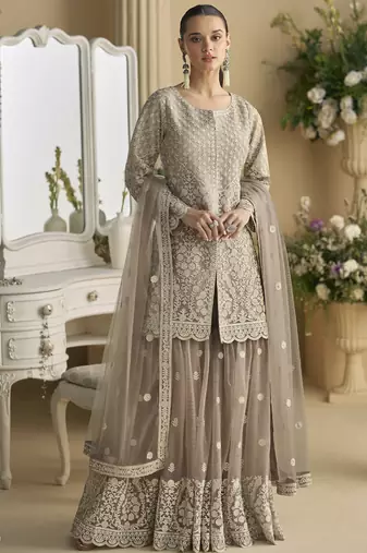 Beige georgette and net embroidered beads work plazzo suit