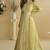 Lemon yellow chinon silk embroidered designer gown with strug