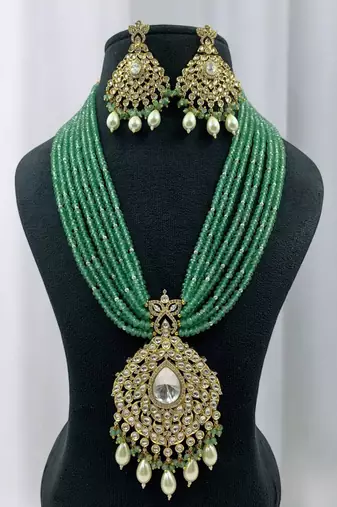 Elegant green beaded kundan necklace set with pearl drops