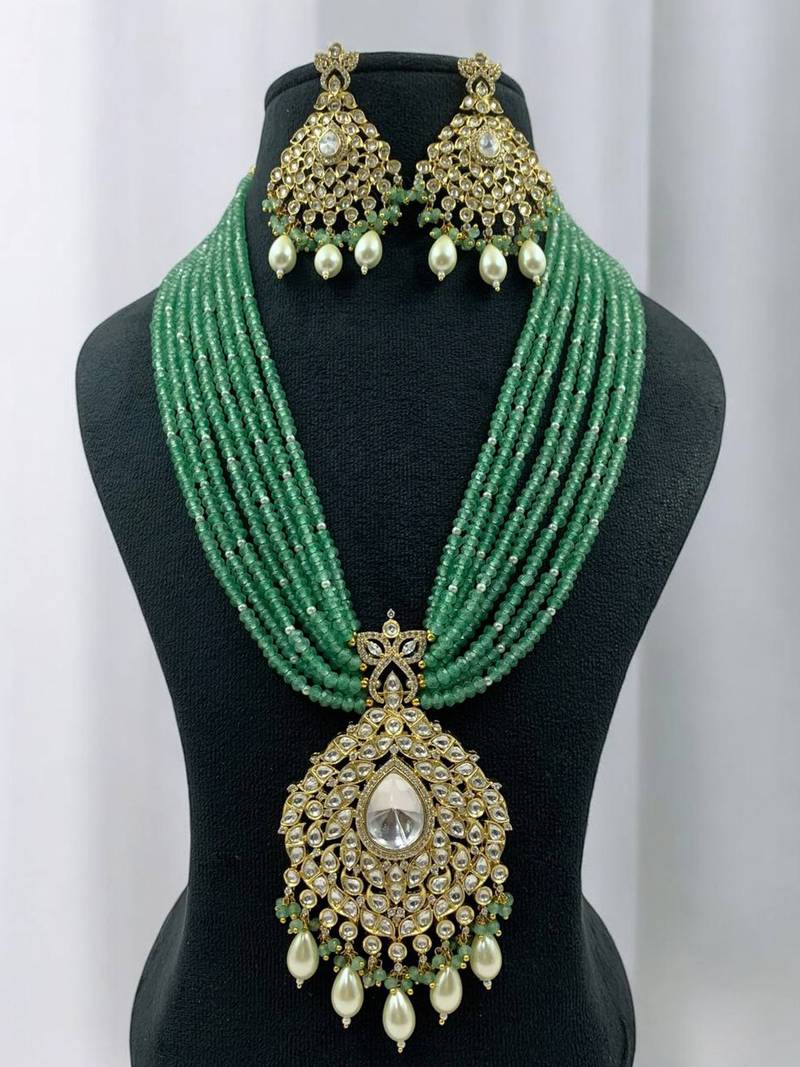 Elegant green beaded kundan necklace set with pearl drops