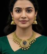 Majestic gold-toned peacock pendant antique kundan necklace set with jhumka earrings