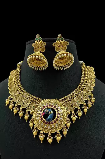Majestic gold-toned peacock pendant antique kundan necklace set with jhumka earrings