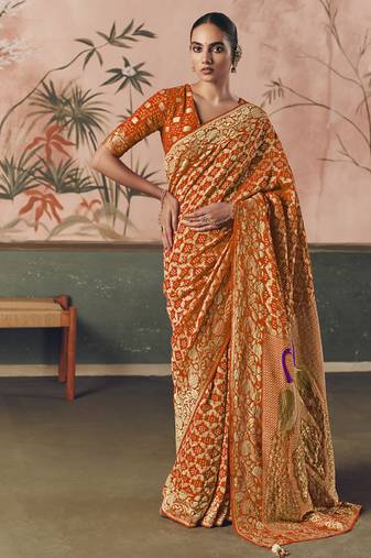Orange khadi georgette with designer weaving work & beautiful tassels bandhani saree