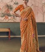 Orange khadi georgette with designer weaving work & beautiful tassels bandhani saree