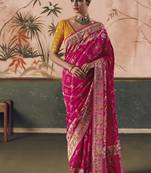 Rani pink khadi georgette with designer weaving work & beautiful tassels bandhani saree