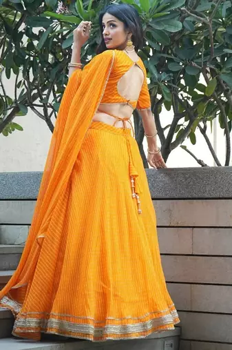 ORANGE ZARI AND CODING LACE WORK WITH LEHERIYA PRINTED GEORGETTE PARTY SEMI STITCHED LEHENGA CHOLI