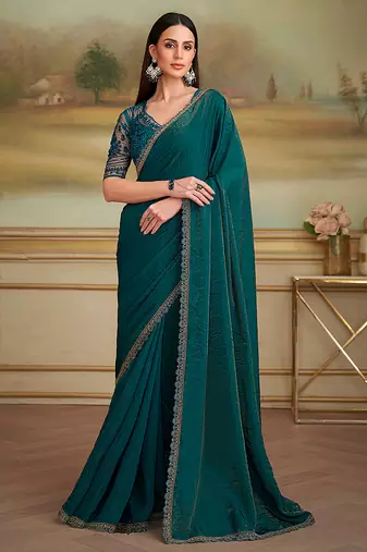 Dark teal shining faux georgette embroidered border party trendy saree