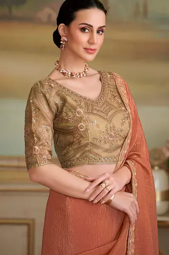 Dark peach gold faux georgette embroidered border saree