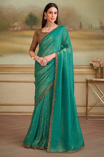 Turquoise gold faux georgette embroidered border party trendy saree