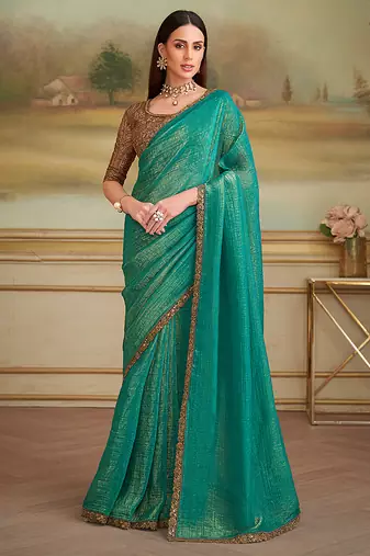 Turquoise gold faux georgette embroidered border party trendy saree
