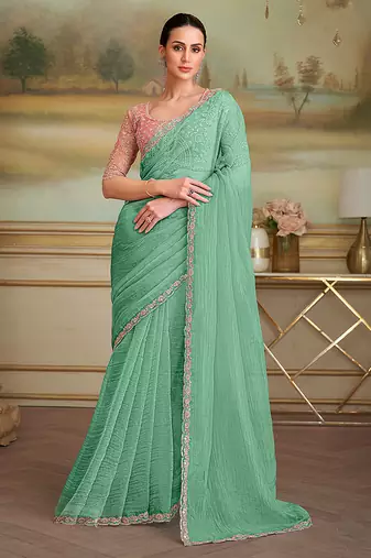 Sea green tissue faux georgette embroidered border party trendy saree