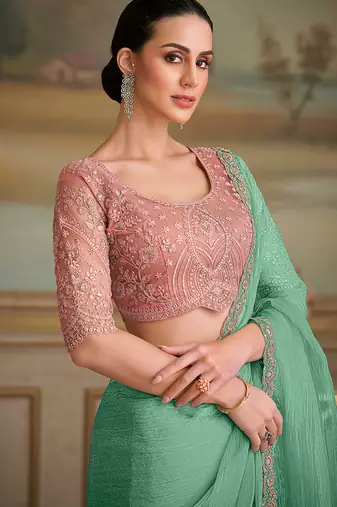 Sea green tissue faux georgette embroidered border saree