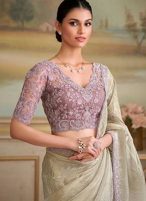 Beige faux georgette embroidered border saree 2