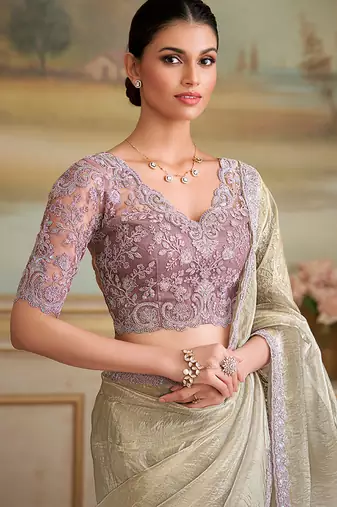 Beige faux georgette embroidered border saree