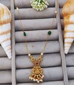 Antique gold lakshmi pendant chain with pearls and green stones for traditional and festive wear