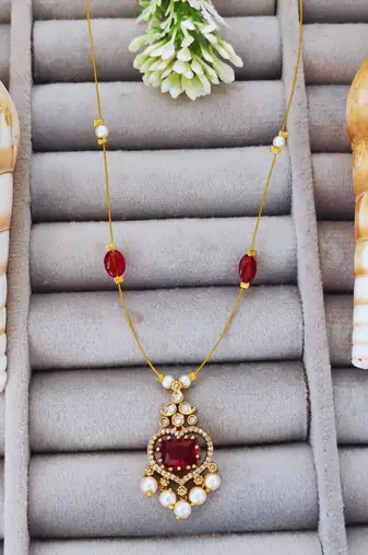 Elegant gold-plated red stone pendant chain with pearl drops