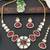 Red stone kundan necklace set with mirror-cut detailing, elegant bridal jewellery with matching earrings