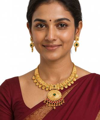 temple necklace set with green and ruby stones, intricate detailing and matching earrings 2