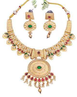 temple necklace set with green and ruby stones, intricate detailing and matching earrings 3