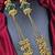 Traditional gold-plated kashmiri jhumka earrings with long chains & green stone