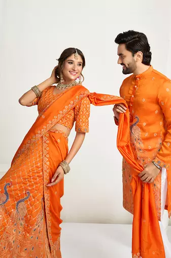 Orange embroidered lehenga & matching men's kurta set couple combo