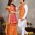 Orange silk men's kurta with payjama and designer saree couple combo