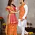 Orange silk men's kurta with payjama and designer saree couple combo