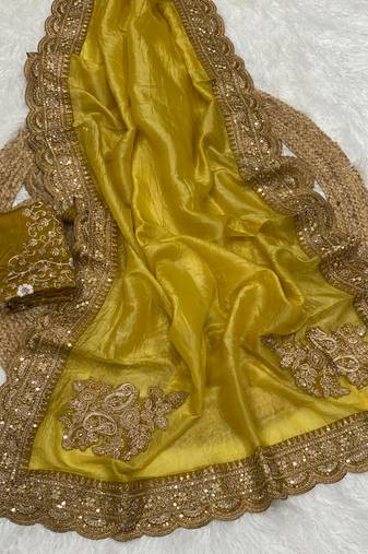 golden color embroidered glass tissue fabric saree