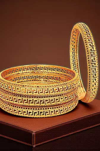 Gold plated set of 4 greek key design bangles