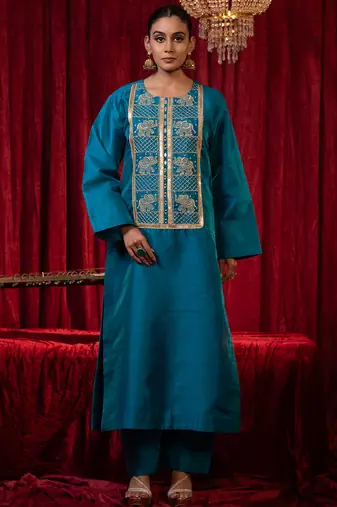Blue round neck raw silk kurta plazzo set with zari embroidery & side pockets