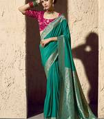 Teal faux crepe georgette zari weaving work saree