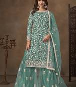 Net embroidered turquoise salwar kameez