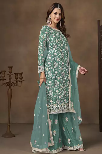 Net embroidered turquoise salwar kameez